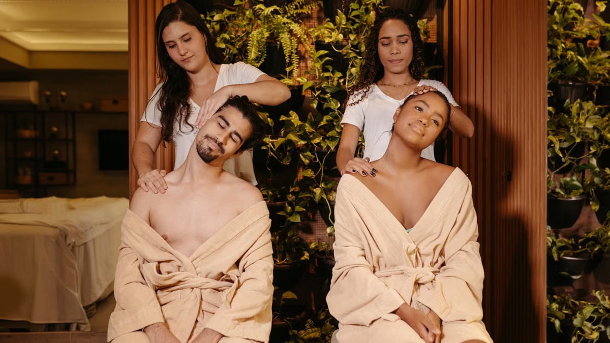 Couple enjoys a rejuvenating massage therapy session in a tranquil spa setting.